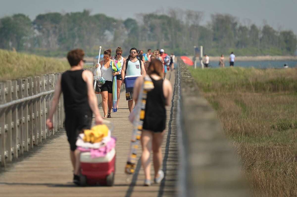 A boardwalk accesses the beach from the parking area at Silver Sands State Park in Milford.