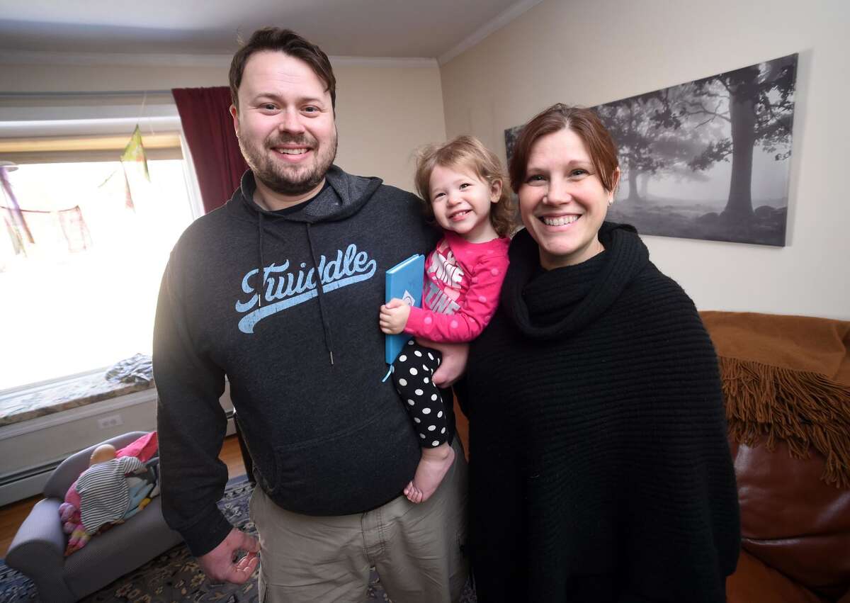 Jim and Katie McGonigal with their daughter, Althea, 18 months, at their home in Woodbridge.
