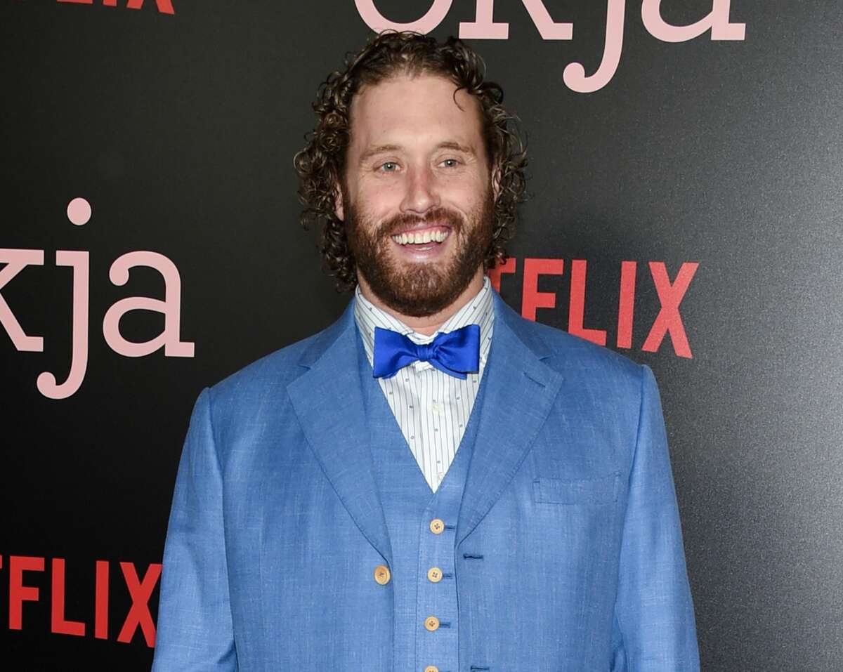 FILE - In this June 8, 2017 file photo, actor T.J. Miller attends the premiere of Netflix's "Okja" in New York. Miller was arrested Monday night, April 9, 2018, at LaGuardia Airport in New York and charged with calling 911 to falsely claim that a woman on the same train as him had a bomb in her luggage. Prosecutors said Miller called in the false bomb information on March 18 after getting into a verbal confrontation with a woman on a train traveling from Washington D.C. to New York. The train was stopped in Westport, Conn., where it was searched. (Photo by Evan Agostini/Invision/AP, File)