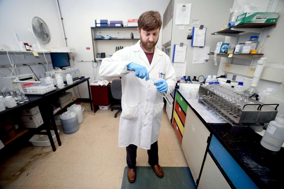 Brian DeBowes sets up a test for phosphates in water samples at the South Central Connecticut Regional Water Authority’s testing lab in New Haven on May 1.