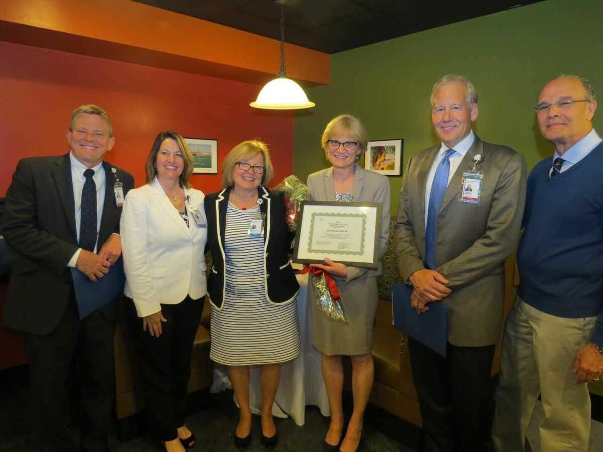 Celebrating at Bridgeport Hospital’s Nurse Manager of the Year reception are from left, Michael Ivy, MD, chief medical officer; MaryEllen Kosturko, chief nursing officer; Peg Parniawski, director, Patient Care Operations; Holly Brancato, award winner; Gregory Buller, MD, associate chief medical officer and chair, department of Medicine; and Kenneth Lipow, MD, medical staff president.