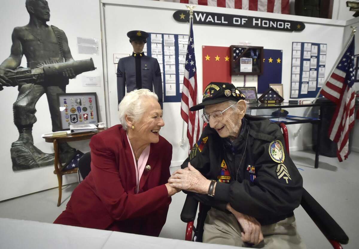 World War II veteran Robert Swirsky of Orange, 98, and Hedwige Kuepper of Milford, 87, have a quiet moment at the West Haven Veterans Museum and Learning Center.