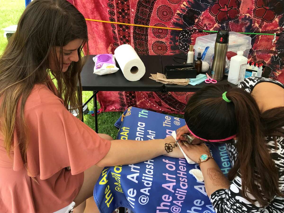 Rene Minnocci has her hand painted at the event.