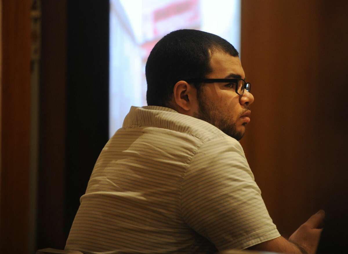 Treizy Lopez, of West Haven, listens to testimony as the state presents its case in his trial for the April 11, 2015 murder of popular Bridgeport store owner Jose Salgado in Superior Court in Bridgeport.