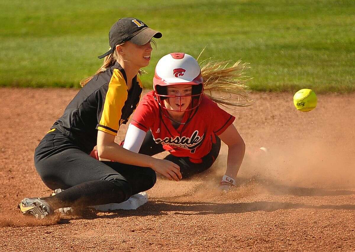 Masuk's Megan McFarland steals second base as the throw gets past Jonathan Law shortstop Cali Jolley in the 2nd inning of Tuesday's Class L softball semifinal at West Haven.