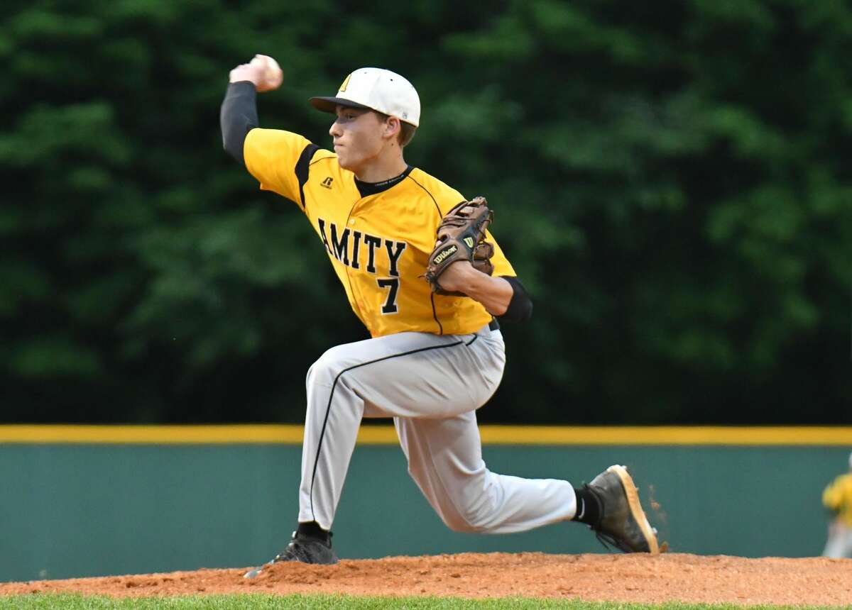 John Lumpinski (7) of the Amity Spartans delivers a pitch during the Class LL baseball semifinal round against the Ridgefield Tigers on Wednesday June 6, 2018, at Municipal Stadium in Waterbury, Connecticut.