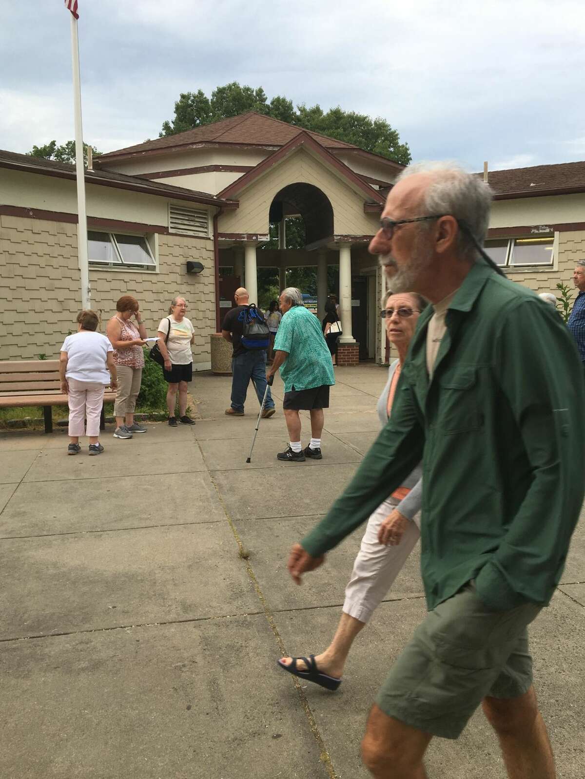 West Haven residents meet at the bathrooms at Old Grove Park along the shorefront walkway at Savin Rock to discuss the fact that the bathrooms are currently are closed on weekends and other city maintenance issues.