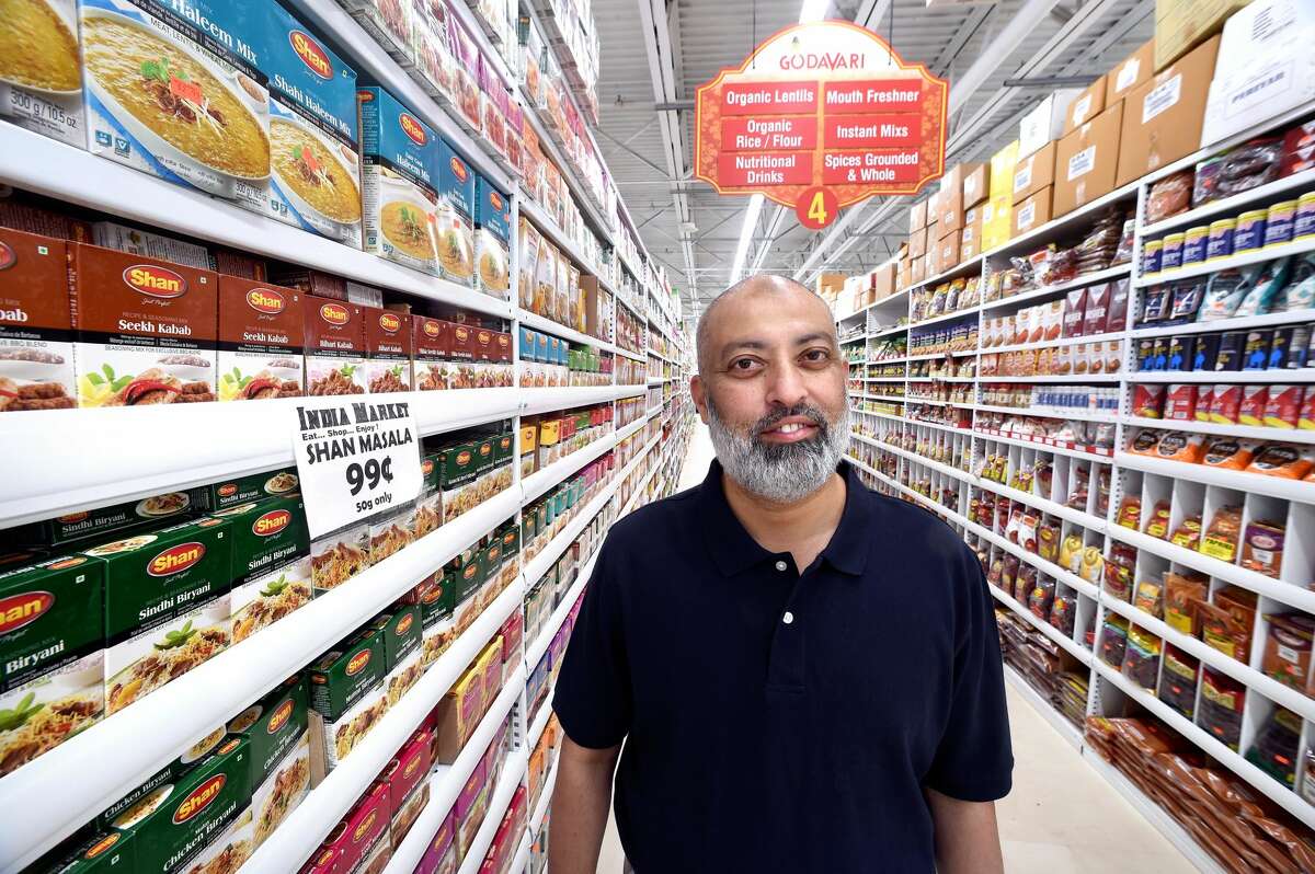 Yousuf Bokhary, owner of India Market, in the store in Orange.
