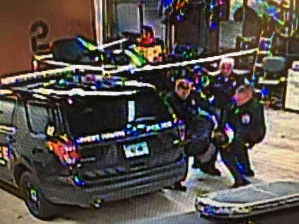 In this image from video, West Haven police officer Joseph Riehl, left, assisted by two other officers, takes down Albert Stober, a homeless man, while trying to subdue Stober and take him into custody on Jan. 29, 2018.