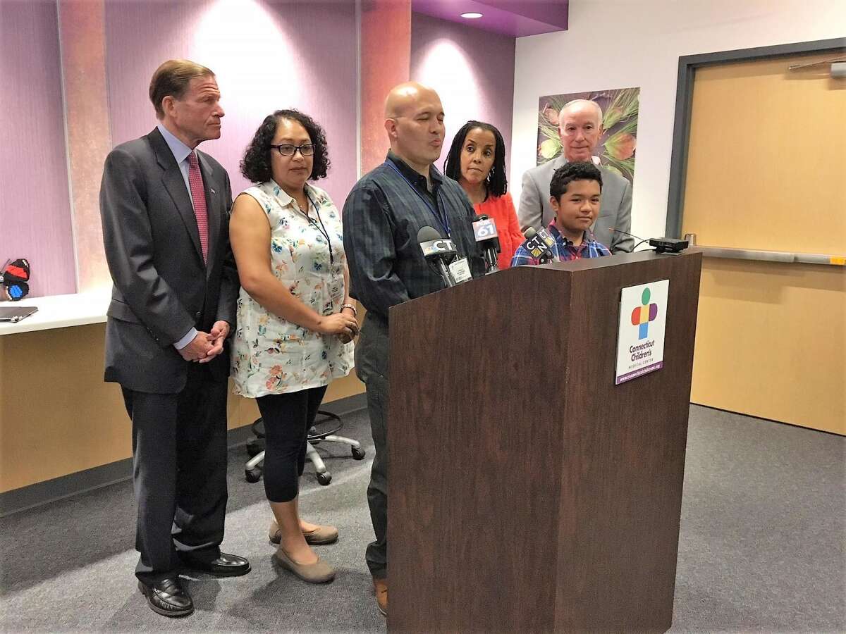 From left, U.S. Sen. Richard Blumenthal, D-Conn., Diana Rodriguez, Julian Rodriguez, Kica Matos, Santi Rodriguez and U.S. Rep. Joe Courtney, D-4, at Connecticut Children's Medical Center.