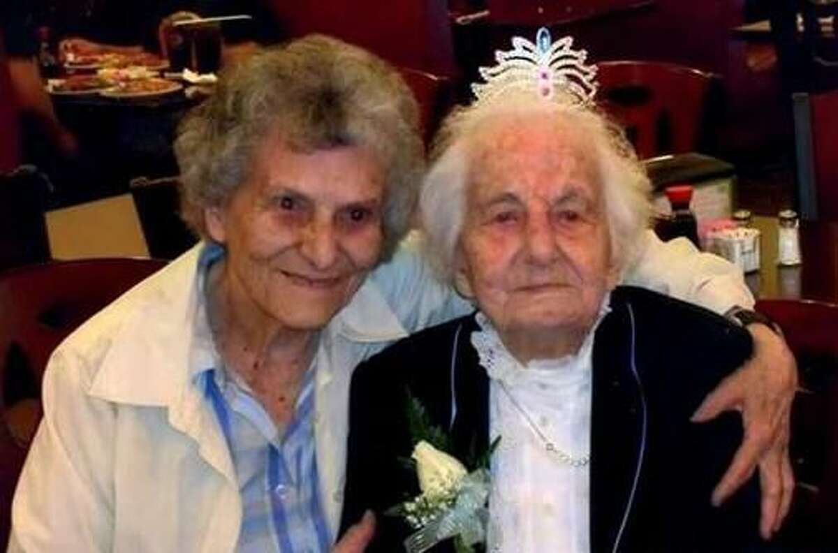 Jennie Recchia Marchitto, right, shown here with her niece Justina Marchitto, wore a tiara at her 100th birthday party. Marchitto, who for years before moving in with her daughter in Guilford was West Haven's oldest active Republican, died Tuesday, Aug. 14 at age 102. She was laid to rest Friday.