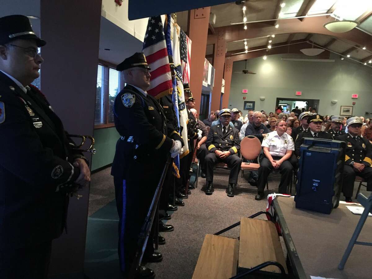 Bugler Kevin McKeon, left, members of the West Haven Police Color Guard and other first responders at West Haven's 17th Anniversary of the Sept. 11, 2001 terrorists attacks in the Savin Rock Conference Center in West Haven.