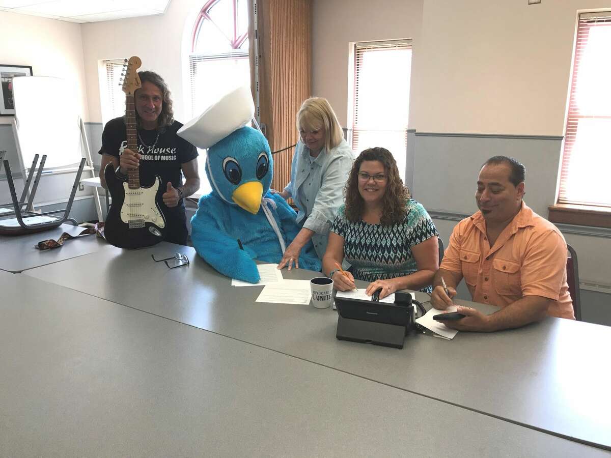 Organizers off the West Haven Community House's upcoming Rock & Stroll fundraiser, featuring the 7th Annual Family Fun Walk and a new music festival, at a recent meeting. From left, John McCarthy from Rock House School of Music, Family Fun Walk mascot Sammy the Seagull, West Haven Community House Executive Director Patty Stevens and Marketing Director Kathy Hart-Jones, and John "Johnny Z" Ziada from Zs Corner Cafe.