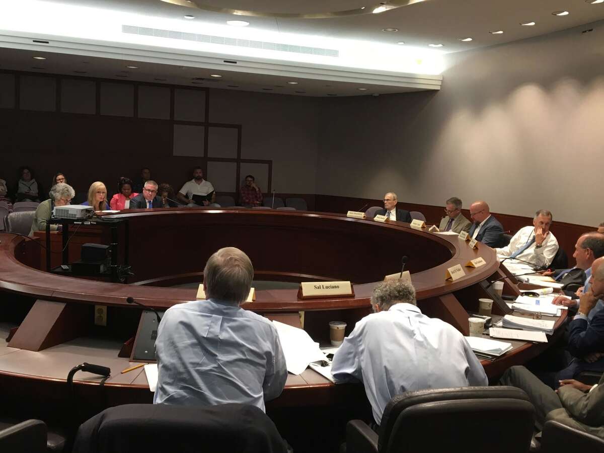 West Haven Mayor Nancy Rossi and consultants Linda Savitsky and Jack Reagan meet with the state Municipal Accountability Review Board in the state Capitol's Legislative Office Building on Friday, Sept. 14.