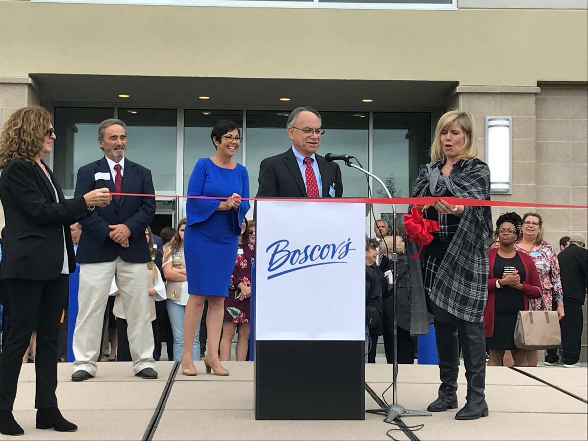Jim Boscov with singer Debbie Boone at the ribbon-cutting.