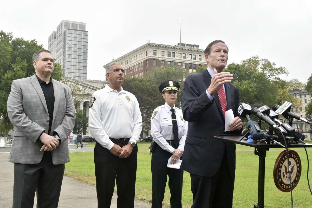 U.S Sen. Richard Blumenthal, D-Conn., right, with, from left, Robert F. Lawlor Jr., drug intelligence officer with the New England High Intensity Drug Trafficking Area; Rick Fontana, director of the New Haven Office of Emergency Management; and New Haven Police Department Assistant Chief Rachael Cain during a news conference Monday on the New Haven Green announcing a federal opioid bill.