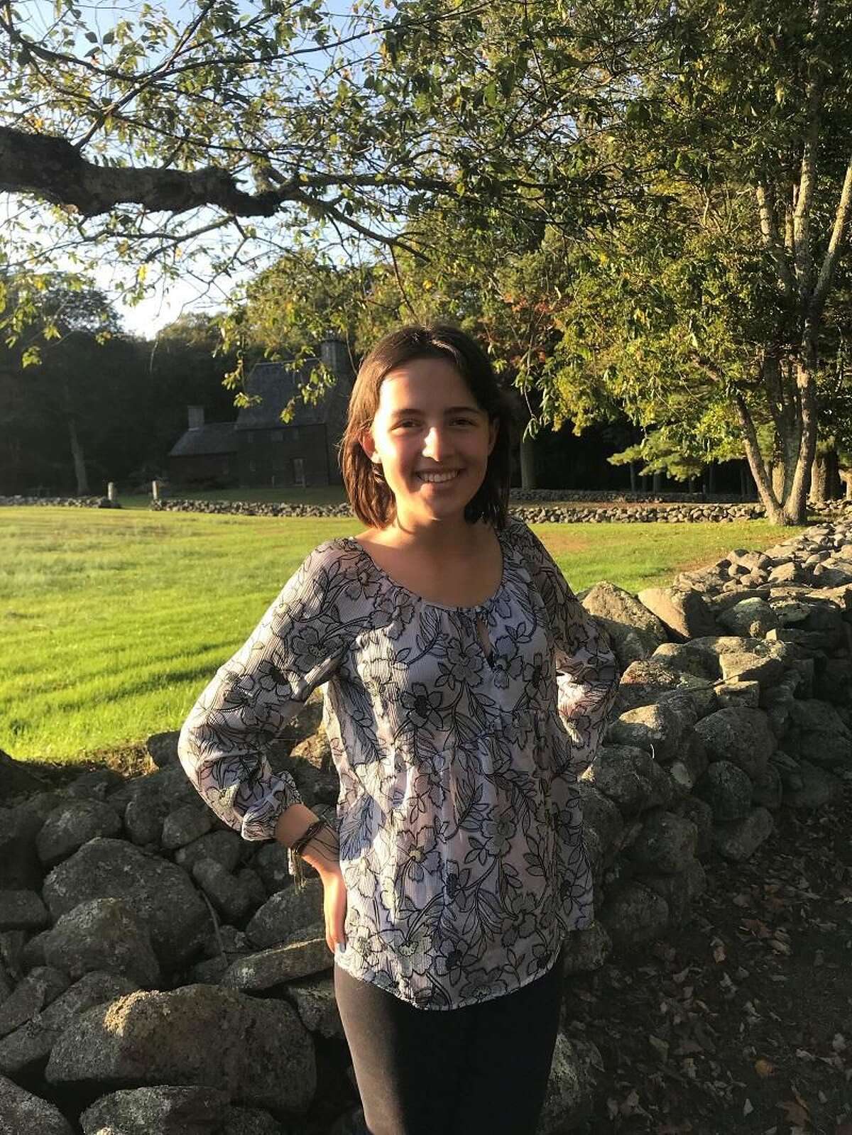 Danielle Burns, 17, survived cancer used her wish with Make-A-Wish Connecticut to bring water to a village in Uganda and attend the ribbon cutting.