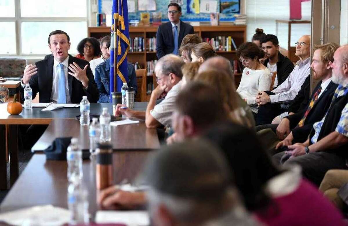 U.S. Sen. Chris Murphy, left, speaks at the Sound School in New Haven Friday about the Long Island Sound Restoration and Stewardship Act that just passed in Congress.