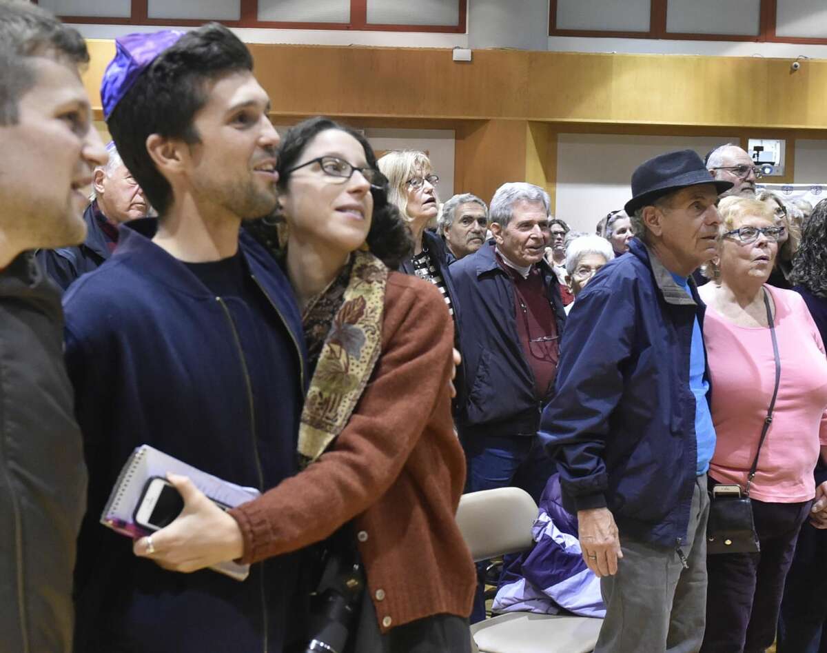 Hundreds of people attended a vigil at the Jewish Community Center in Woodbridge Sunday evening in response to the Pittsburgh Synagogue shooting Saturday.