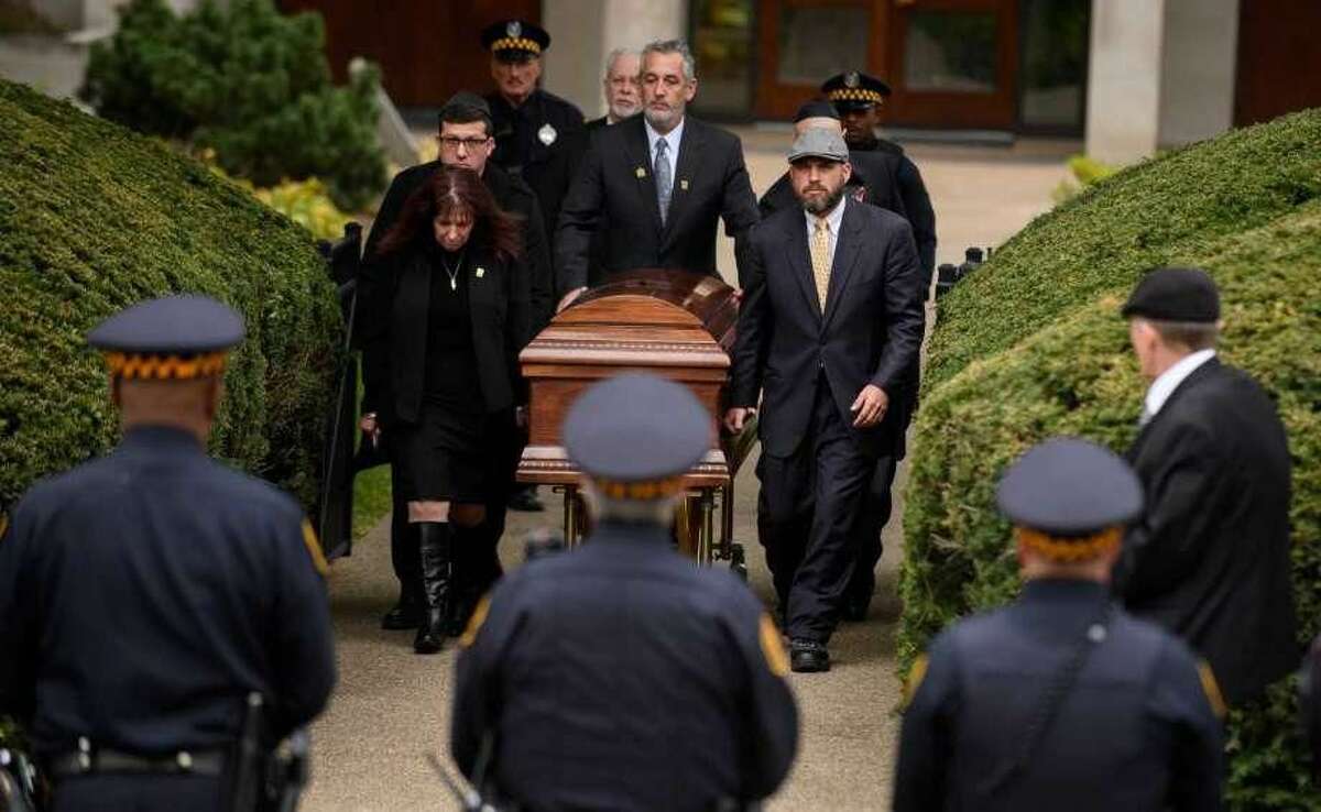 The casket of Irving Younger is led to a hearse outside Rodef Shalom Temple following his funeral on Oct. 31 in Pittsburgh, Pennsylvania. Irving Younger was one of 11 people killed in the mass shooting at the Tree of Life Synagogue on Oct. 27.
