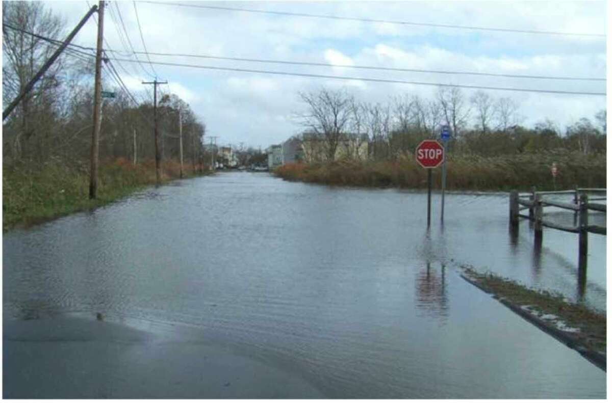 Floodwaters rise at Morse Avenue and Blohm Street along Old Field Creek during Superstorm Sandy.