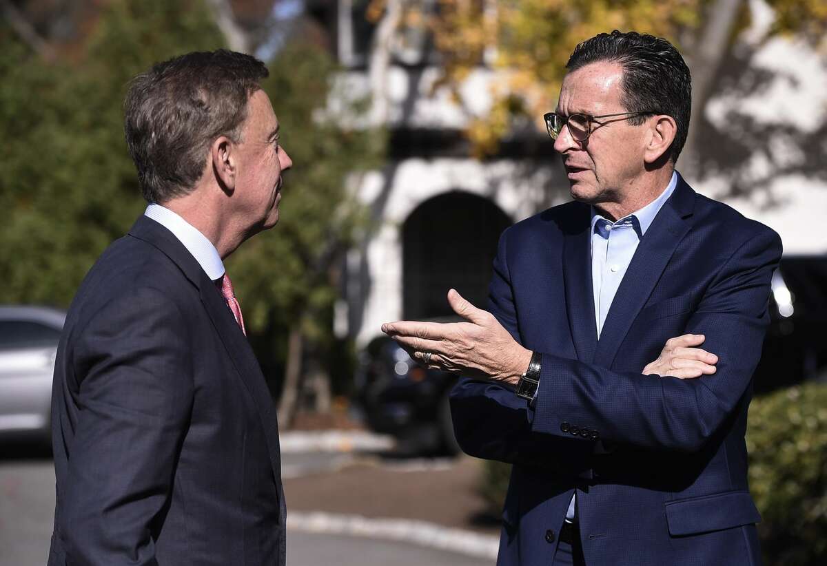 Gov. Dannel P. Malloy, right, talks with Connecticut's governor-elect Ned Lamont at the governor's residence in Hartford on Nov. 8.