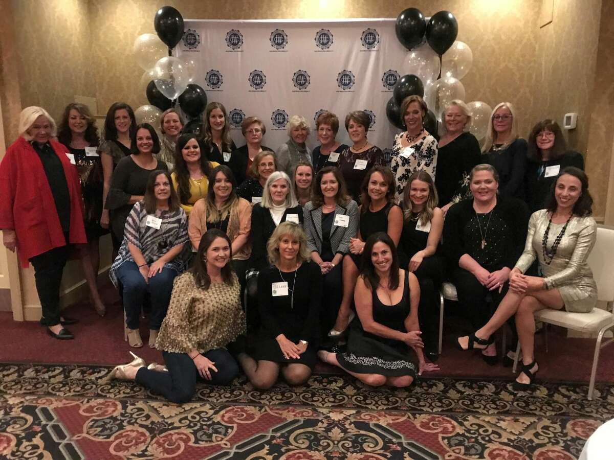 Members of the Junior Woman's Club of Milford celebrated the club's 50th anniversary with founding member Sharon Roche (at center in turtleneck).