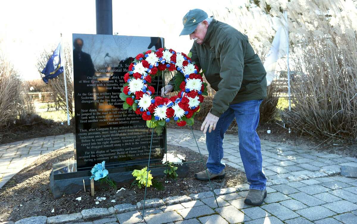 Vietnam veteran Dave Ricci of West Haven lays a wreath at the William A. Soderman Memorial Flagpole during a commemoration of the 77th anniversary of the Japanese bombing of Pearl Harbor at Bradley Point Park in West Haven on Dec. 7, 2018.