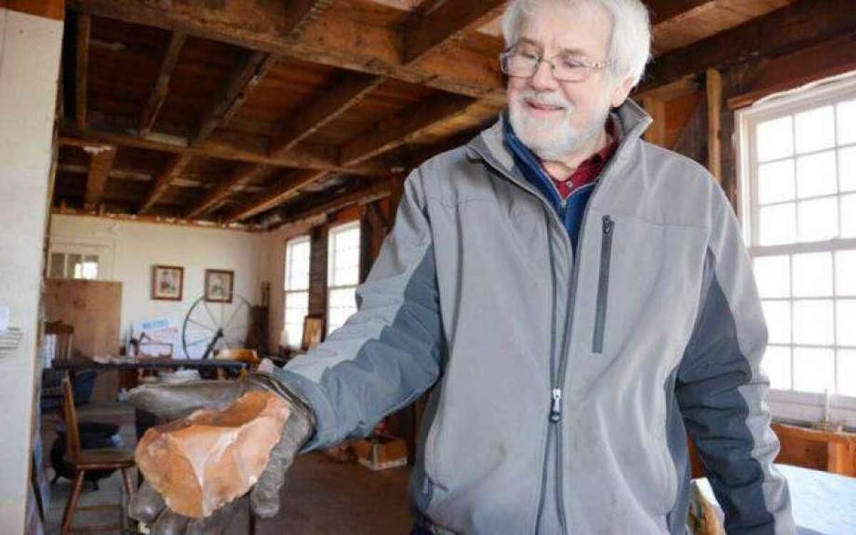 Tim Chaucer holds the Acheulean hand axe, which he believes is up to one million years old.