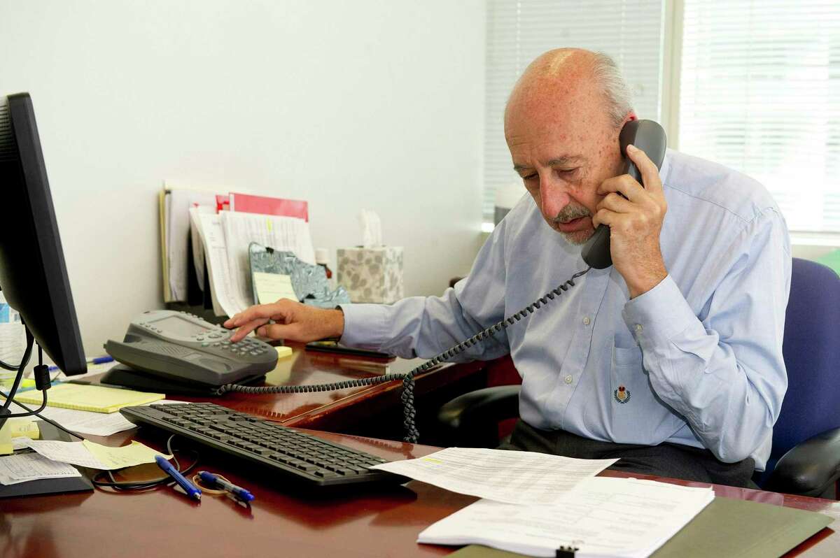Martin Levine, special adviser to Stamford Mayor David Martin, makes phone calls in his Government Center office on Wednesday, July 9, 2014.