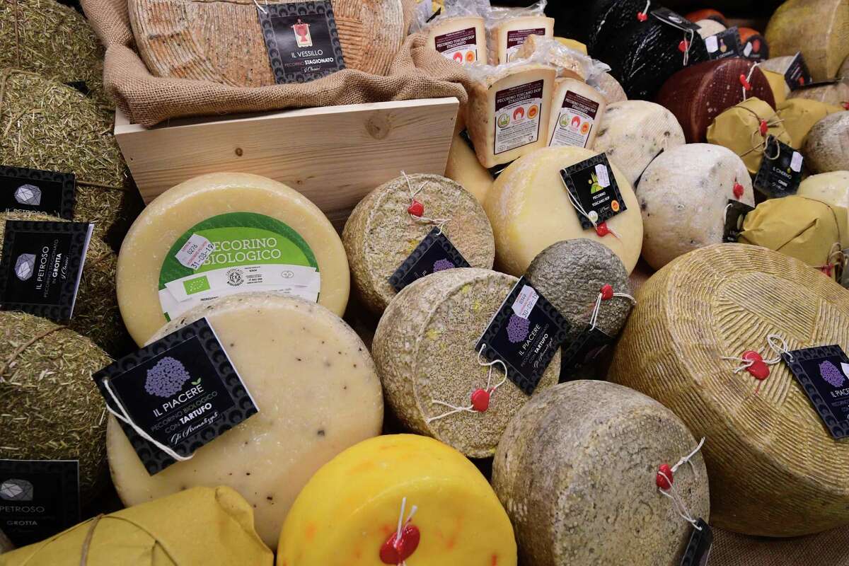 (FILES) In this file photo taken on May 7, 2019 Pecorino cheeses produced by Rocca Toscana Formaggi are displayed at the TUTTOFOOD fair, the international B2B show dedicated to food and beverage, in Milan. - From whisky and wine to parkas and cashmere sweaters to cheese, the US has released a list of imported European products slapped with tariffs in the battle between Washington and Brussels over aircraft subsidies. The US trade representatives list includes more than 150 products, principally from Germany, France, Spain and the UK, but also across Europe, that will face a 25 percent tariff from October 18. (Photo by Miguel MEDINA / AFP) (Photo by MIGUEL MEDINA/AFP via Getty Images)
