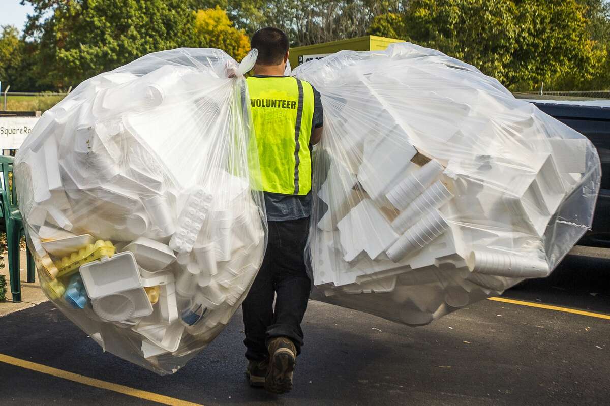 A volunteer carries bags of styrofoam items at Midland Recyclers Thursday, Oct. 10, 2019 inside the facility. (Katy Kildee/kkildee@mdn.net)