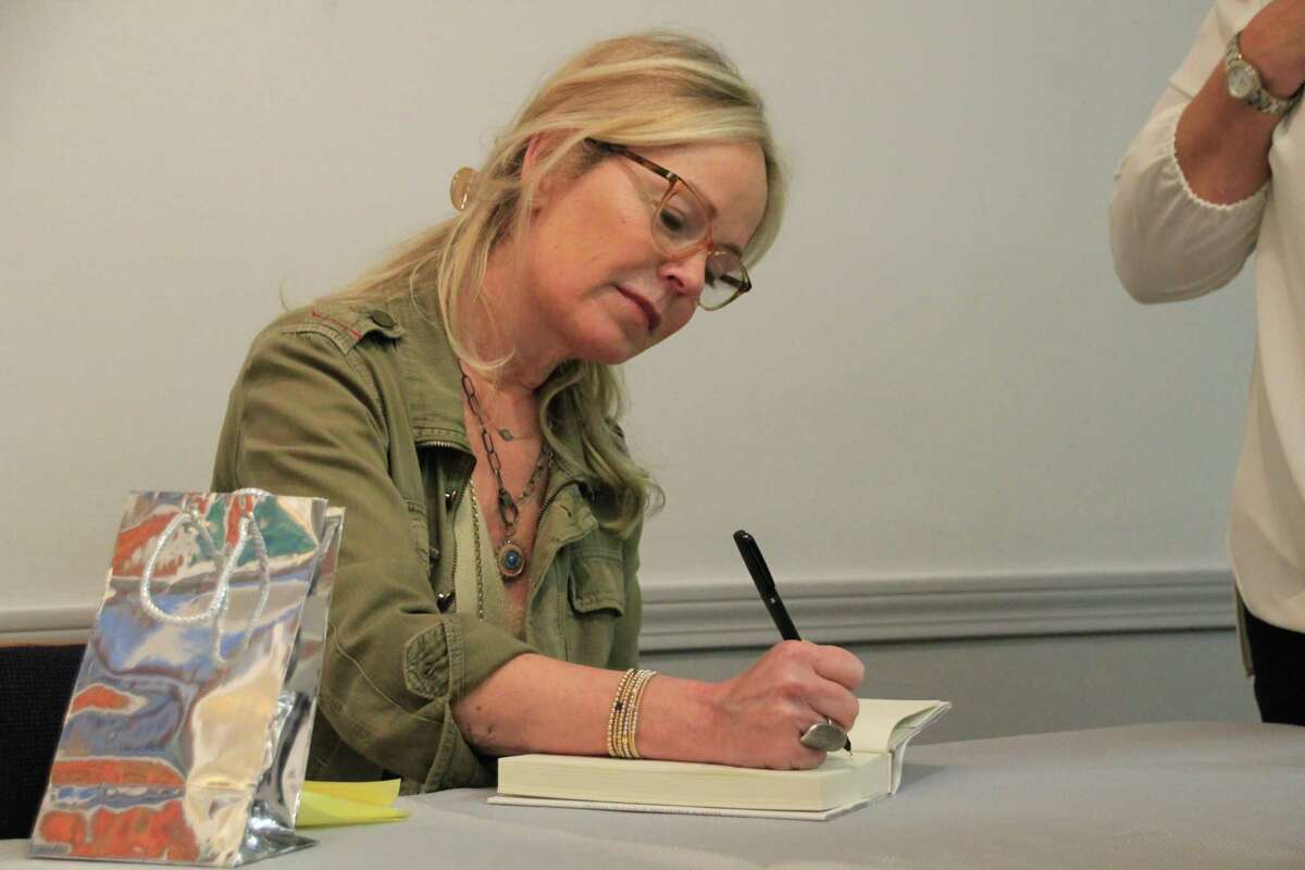 Author Dani Shapiro signs copies of her book, “Inheritance: A Memoir of Genealogy, Paternity and Love,” at an event at Brookfield Library. Residents across Brookfield read the book as part of the summer "One Town, One Read" program.