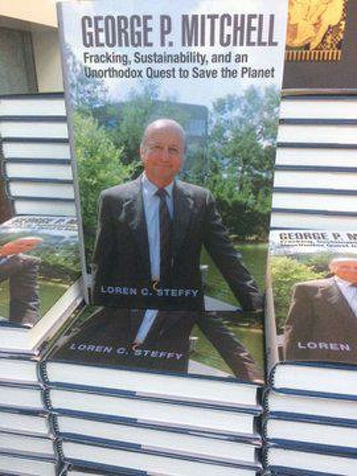 Loren C. Steffy signs copies of his new book on Oct. 10, 2019, which is about oil tycoon and founder of The Woodlands George Mitchell. The book — titled “George P. Mitchell: fracking, sustainability, and an unorthodox quest to save the planet” — was recently published in hardback form and was on sale during the event