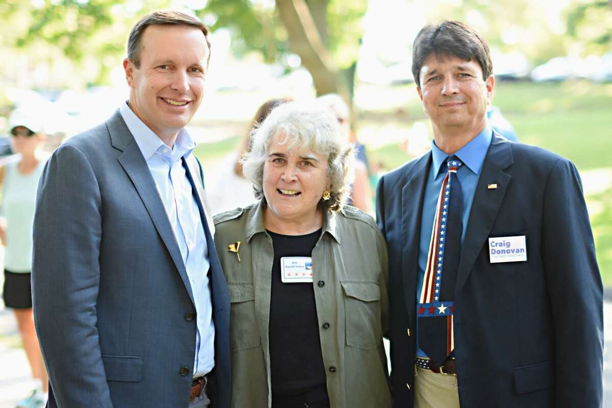 U.S Sen. Chris Murphy, New Canaan Selectman Kit Devereaux and then First Selectman Candidate Craig Donovan stand for a photo at one of the New Canaan Democratic Town Committee's barbecues during a recent year. Devereaux is leaving the town for Annapolis, Maryland, in August to be nearer her daughter Anne, and her grandson William Coldstock.