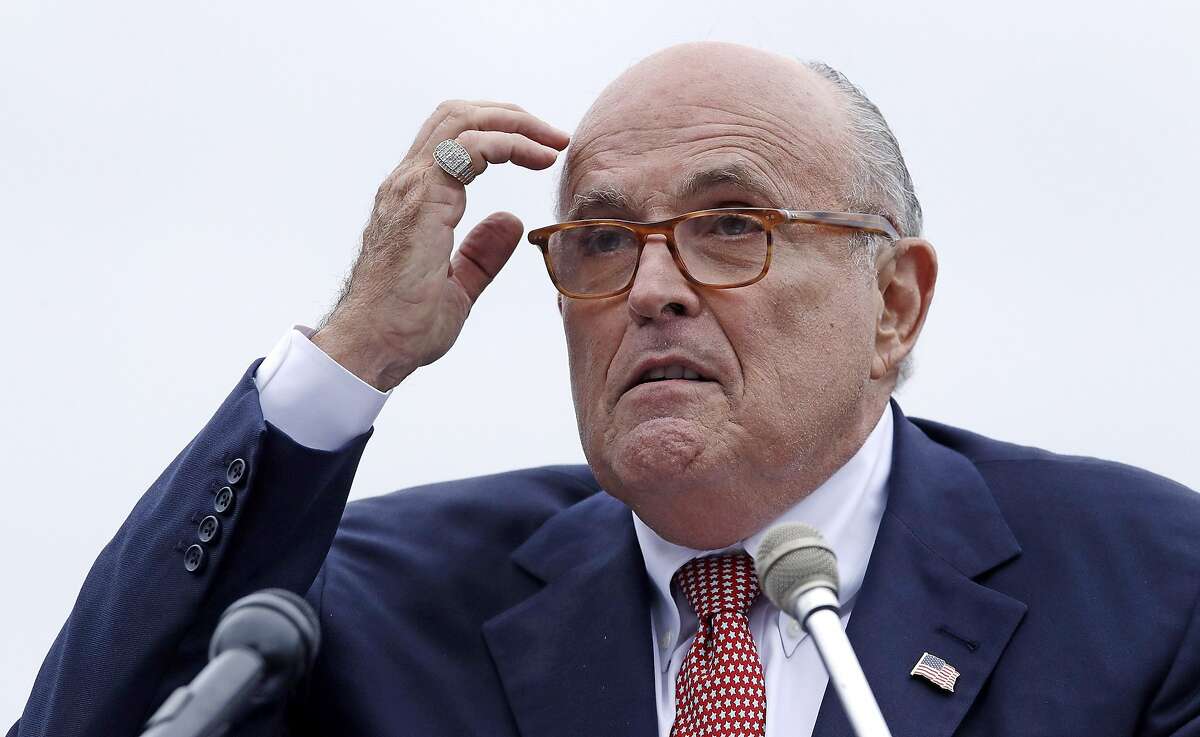 FILE - In this Aug. 1, 2018 file photo, Rudy Giuliani, attorney for President Donald Trump, addresses a gathering during a campaign event in Portsmouth, N.H. House committees have subpoena Giuliani for documents related to Ukraine. (AP Photo/Charles Krupa, File )