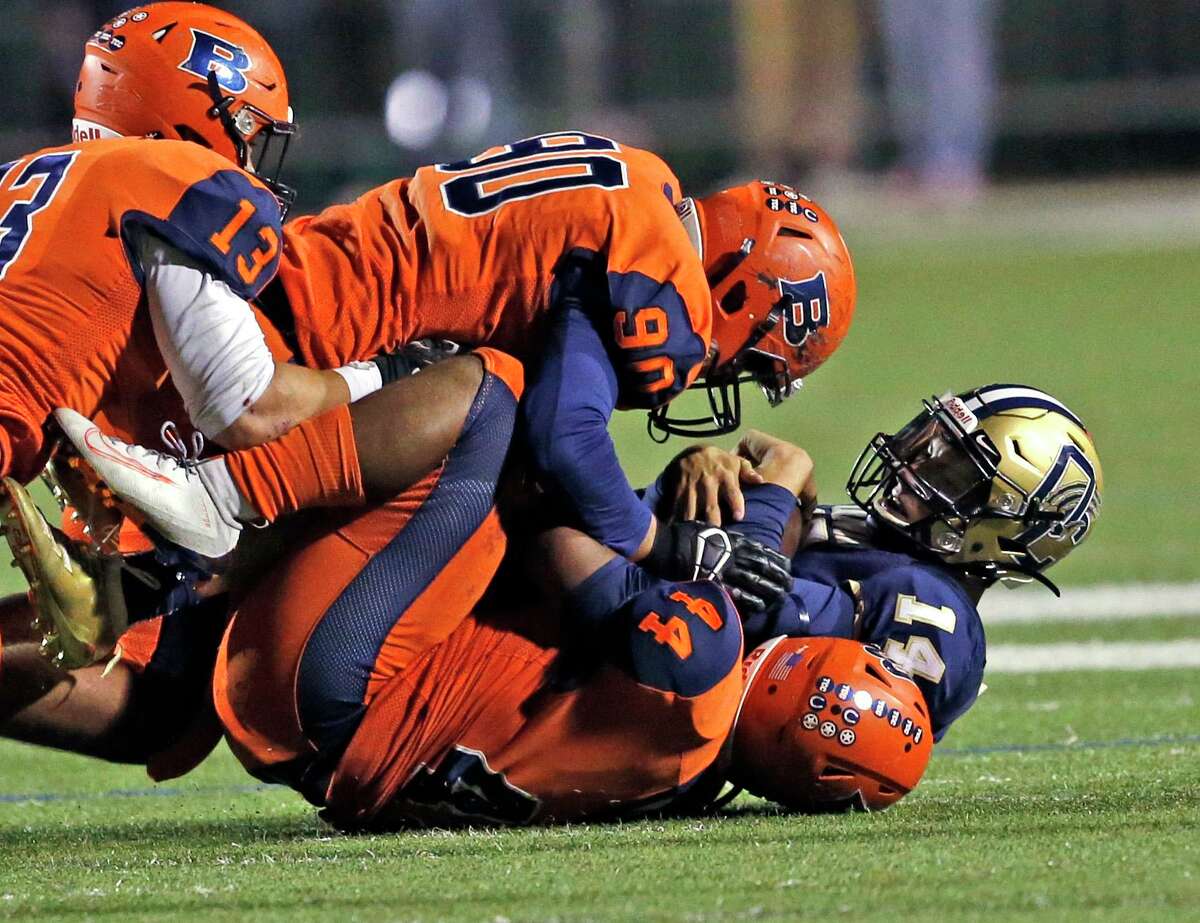 Brandeis linebacker Joshua Green,on bottom and Nicholas Dominquez tackle O'Connor quarterback David Dodd in a 28-6A football contest between Brandeis vs. OConnor at Farris Stadium on Friday October 11, 2019. Brandeis defeated O'Connor 37-15.