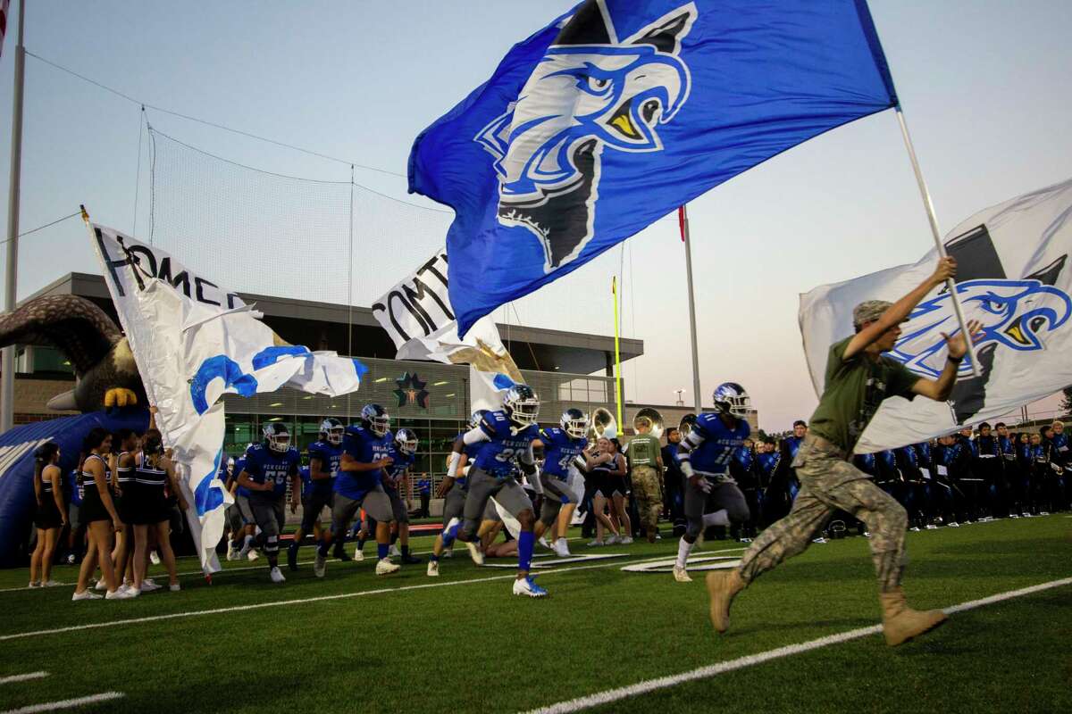 The New Caney Eagles take the field before a District 9-5A (Div. I) footbal game Friday, October 4, 2019 at Randall Reed Stadium in New Caney.