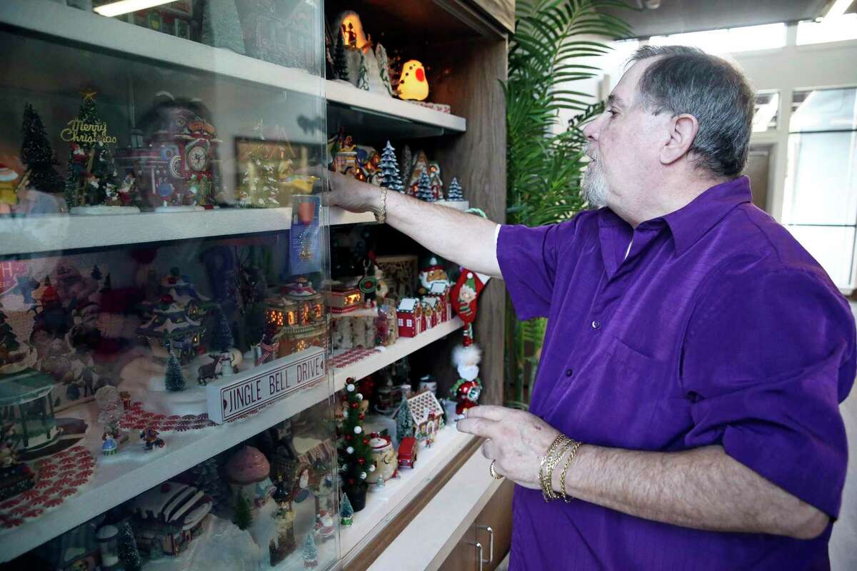 Glenn Dresh sets up the Christmas display at a Ronald McDonald House near the Medical Center. For the past 15 years, Dresh has used his own time and money to keep the spirit of Christmas alive for sick children at all four local Ronald McDonald Houses by maintaining yuletide displays all year long.