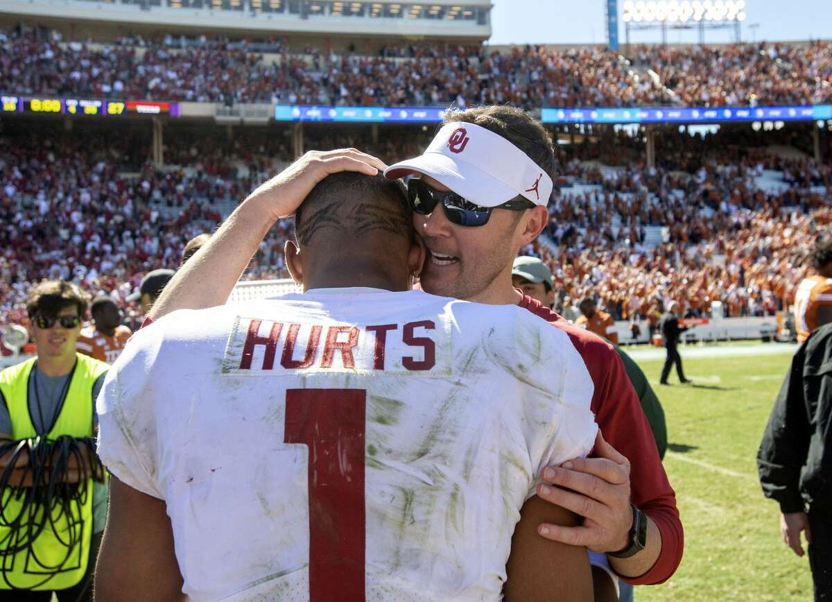 Oklahoma head coach Lincoln Riley congratulates quarterback Jalen Hurts (1) after beating Texas 34-27 in an NCAA college football game at the Cotton Bowl, Saturday, Oct. 12, 2019, in Dallas.