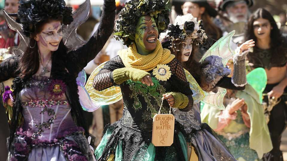 Performers parade through the grounds during the Texas Renaissance Festival Saturday, Oct. 12, 2019, in Todd Mission.