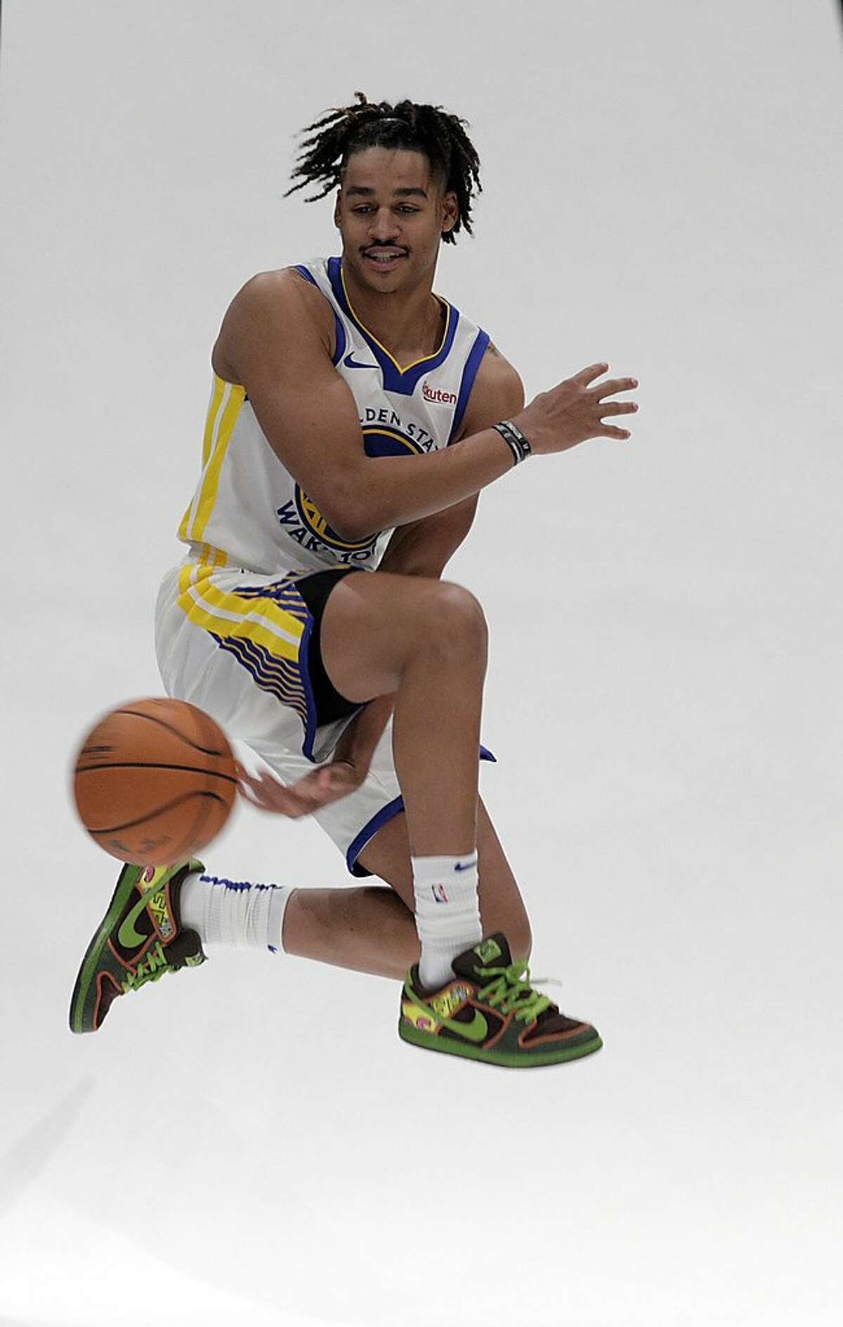 Jordan Poole (3) passes the ball between his legs for a portrait during media day for the Golden State Warriors at Chase Arena in San Francisco, Calif., on Monday, September 30, 2019.