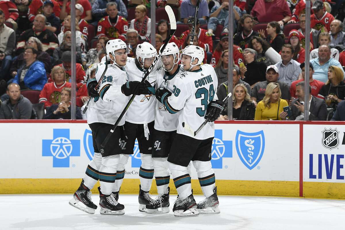 HICAGO, IL - OCTOBER 10: (L-R) Timo Meier #28, Brenden Dillon #4, Patrick Marleau #12 and Logan Couture #39 of the San Jose Sharks celebrate after scoring against the Chicago Blackhawks in the second period at the United Center on October 10, 2019 in Chicago, Illinois. (Photo by