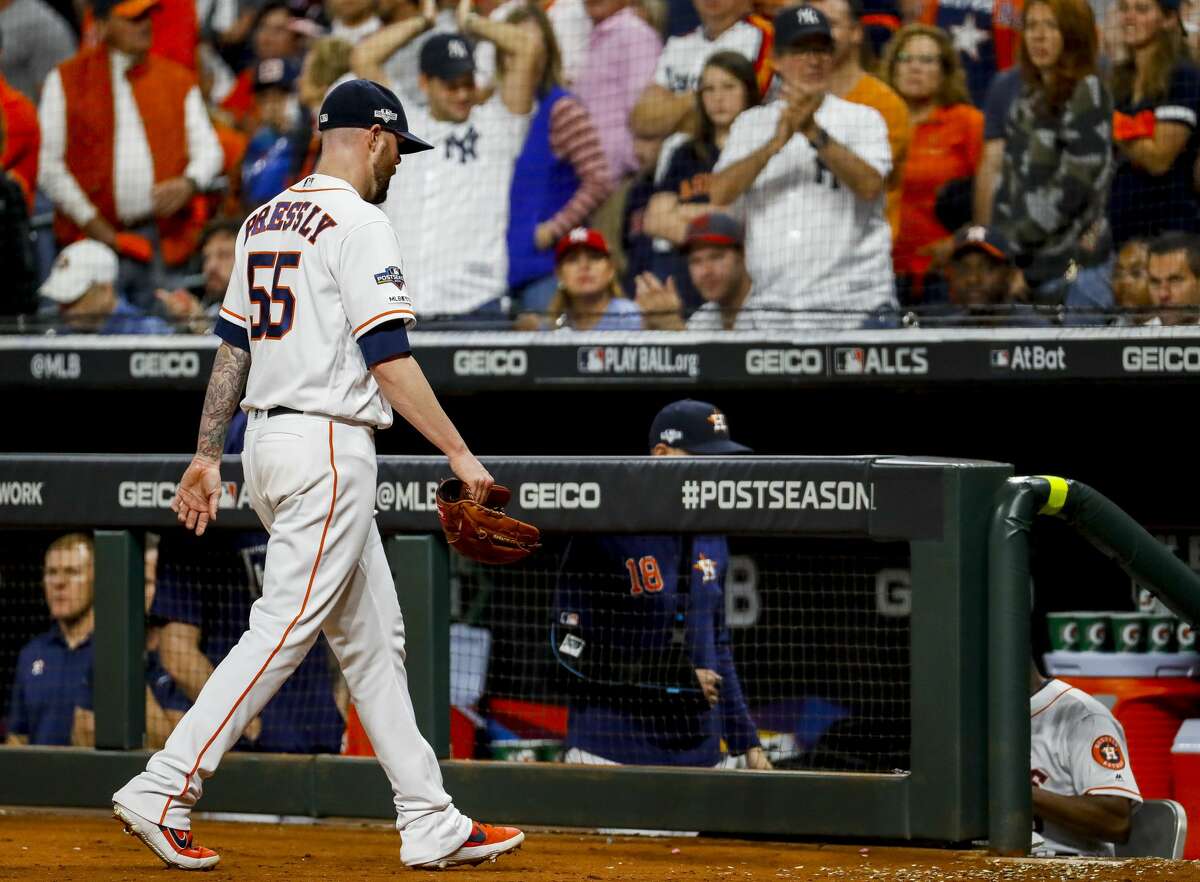 Houston Astros relief pitcher Ryan Pressly (55) leaves the game after giving up two runs during the seventh inning of Game 1 of the American League Championship Series at Minute Maid Park on Saturday, Oct. 12, 2019, in Houston.