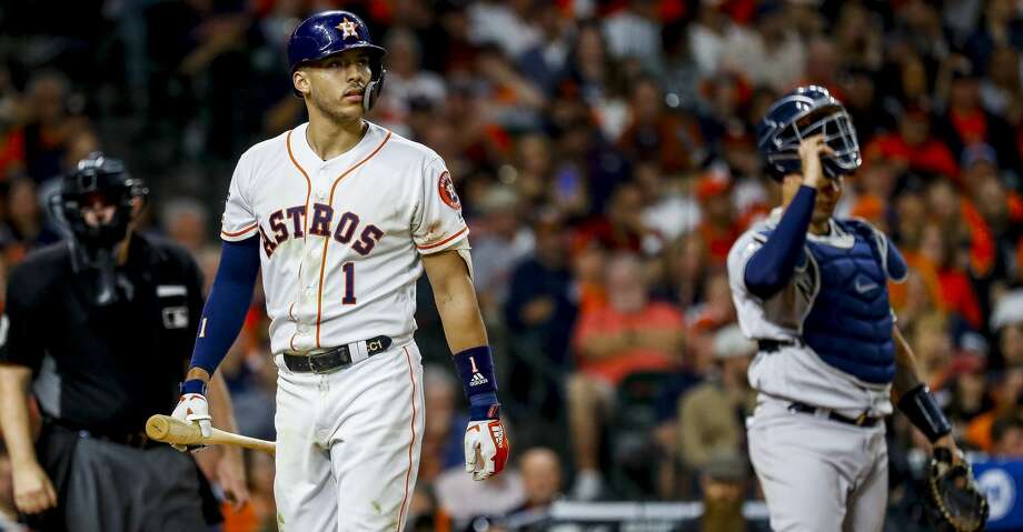 Houston Astros shortstop Carlos Correa (1) strikes out swinging during the eighth inning of Game 1 of the American League Championship Series at Minute Maid Park on Saturday, Oct. 12, 2019, in Houston. Photo: Karen Warren/Staff Photographer