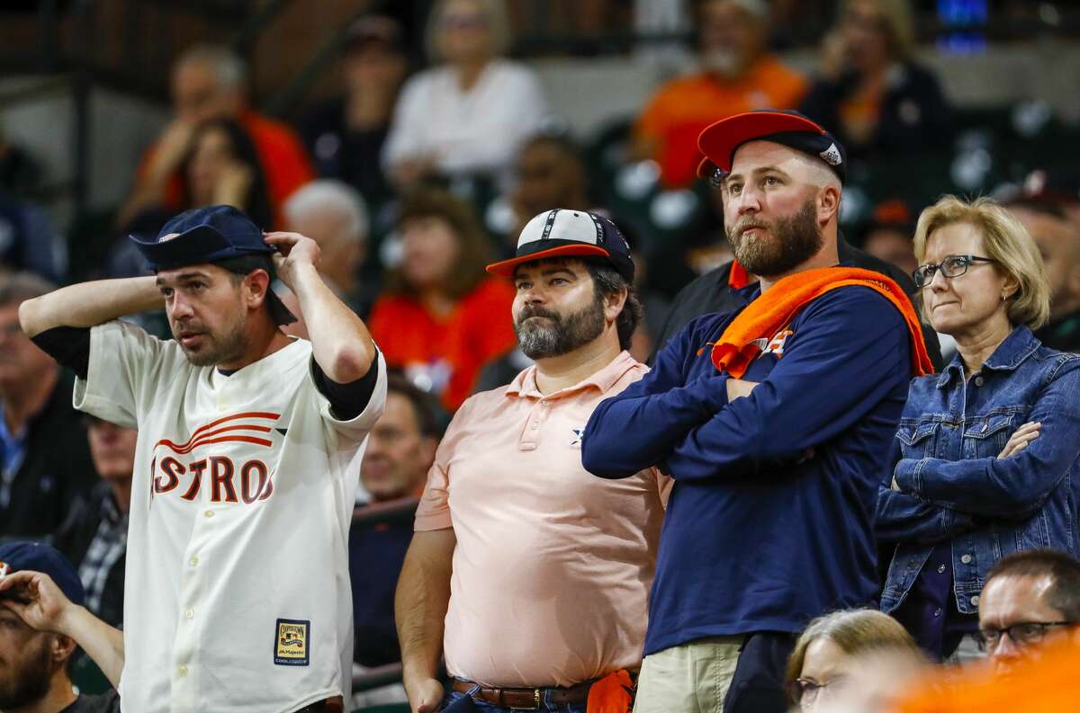 Astros fans watch the ninth inning of a 7-0 lead by the Yankees during Game 1 of the American League Championship Series at Minute Maid Park on Saturday, Oct. 12, 2019, in Houston.