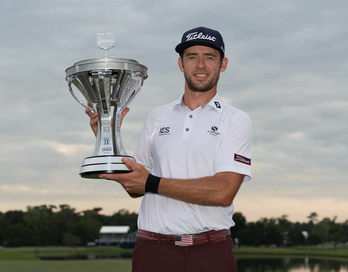 Lanto Griffin poses with the Houston Open trophy at the Golf Club of Houston in Humble Texas on Sunday, October 13, 2019.