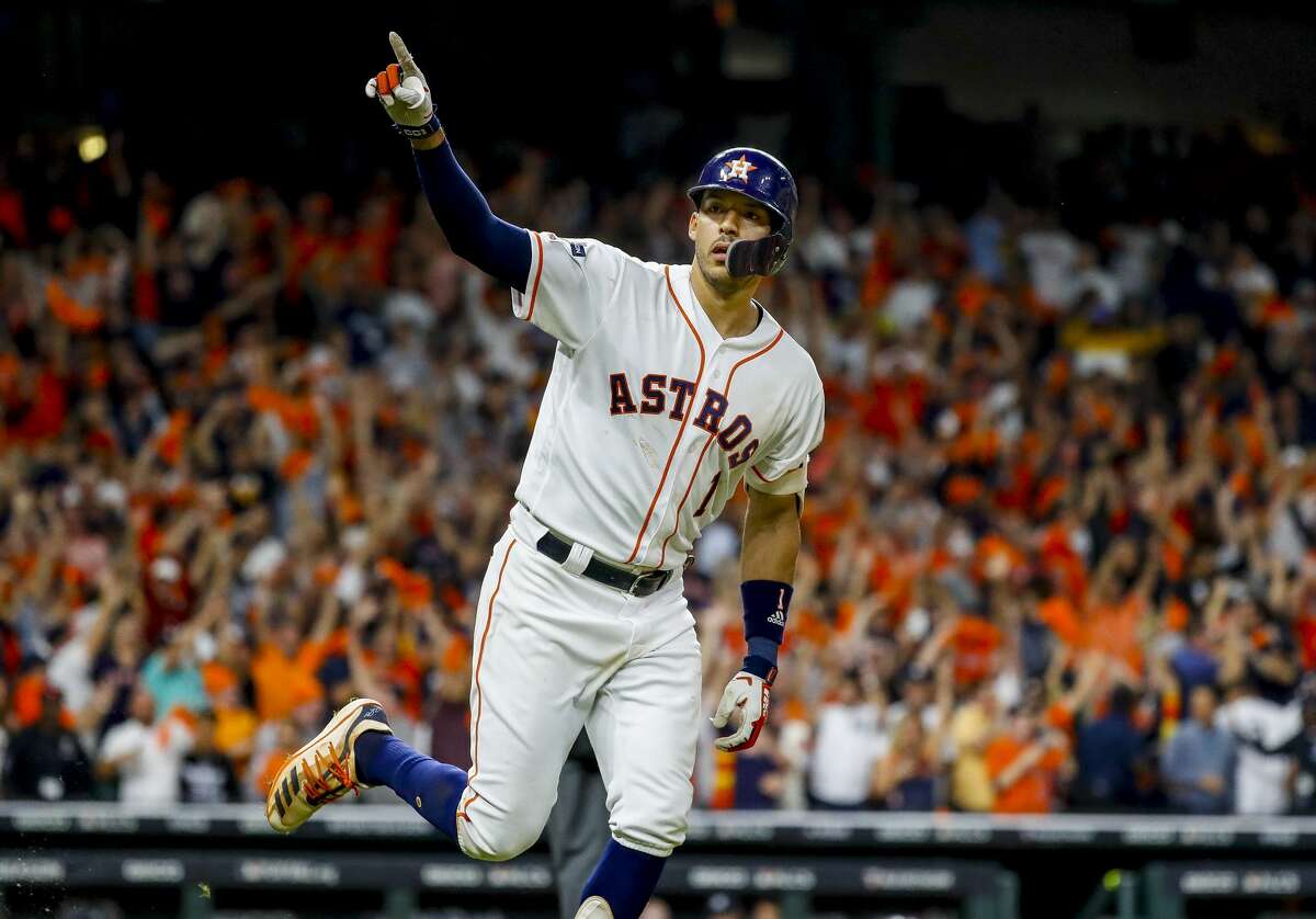 Houston Astros shortstop Carlos Correa (1) celebrates his walk off home run in the eleventh inning to win Game 2 of the American League Championship Series at Minute Maid Park on Sunday, Oct. 13, 2019, in Houston.