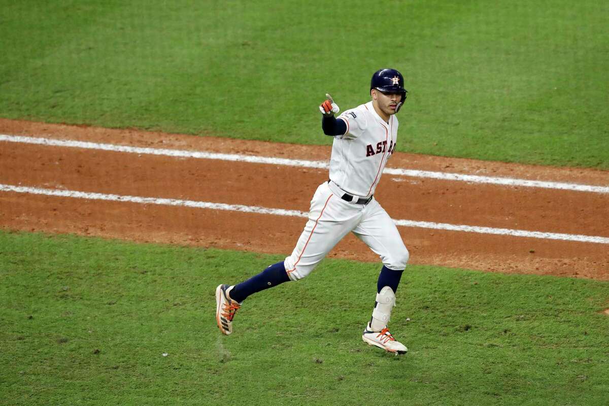 Astros shortstop Carlos Correa celebrates hitting a walk-off home run in the eleventh inning Sunday for a 3-2 win over the Yankees in Houston. Correa was pointing for Laredo’s Jalen Garcia who he told Friday in a visit to the MD Anderson Cancer Center that the next home run he hit would be for him.
