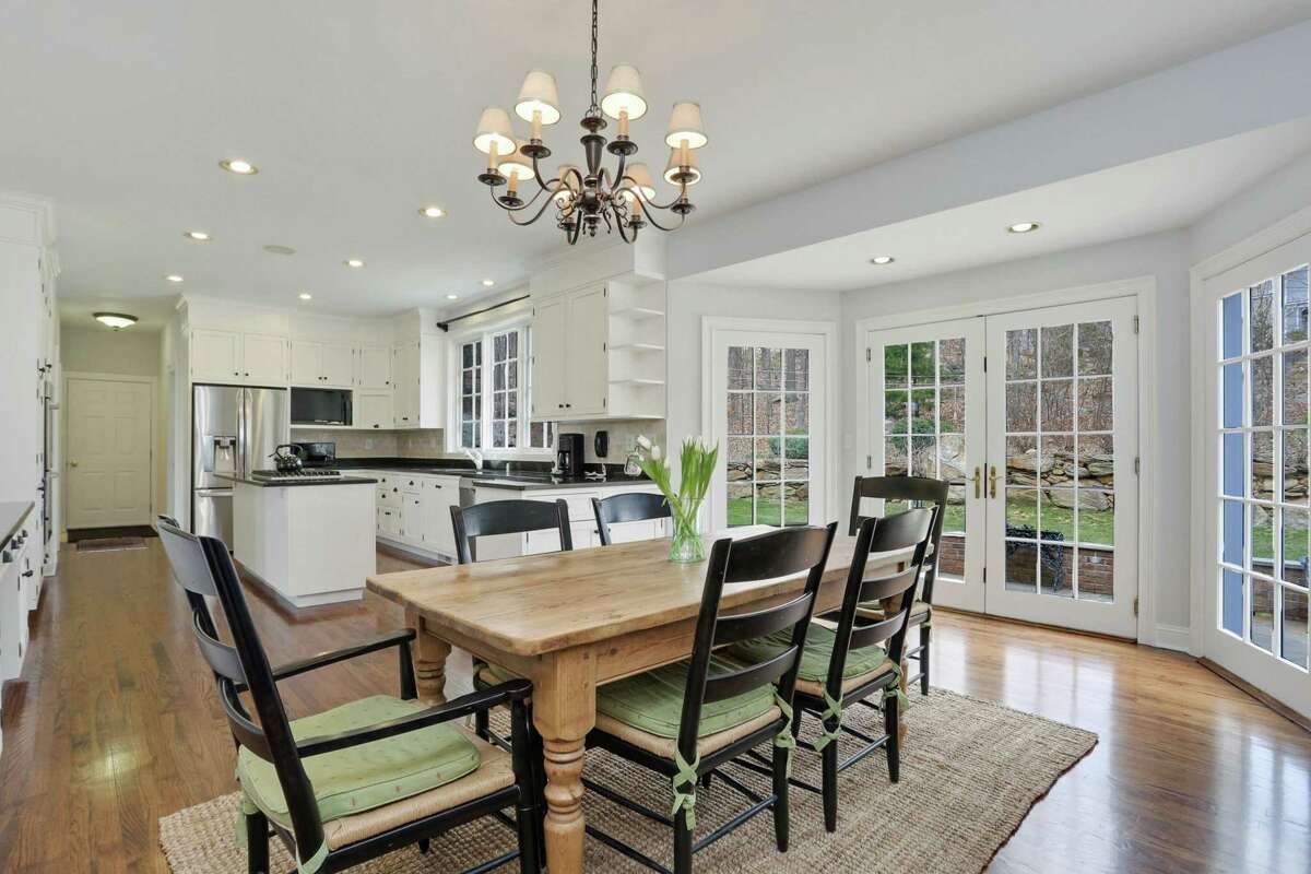The eat-in area of the kitchen has French doors to the bluestone patio ad backyard.